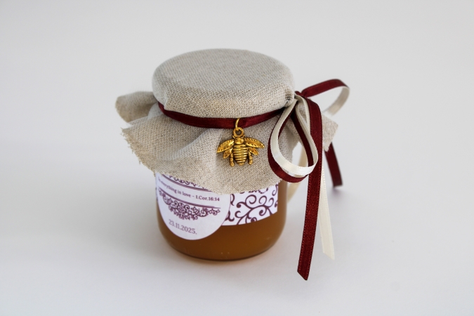 Medus dāvanu burciņa ar zelta bitīti.