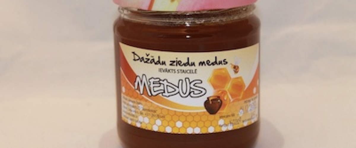 Dažādu ziedu medus stikla burciņā