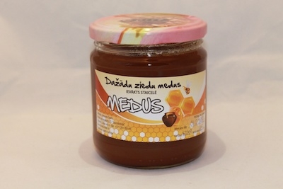 Dažādu ziedu medus stikla burciņā