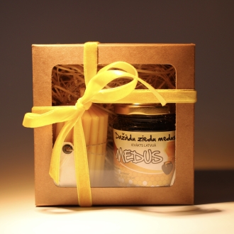 Dāvanu komplekts vaska svece un medus.